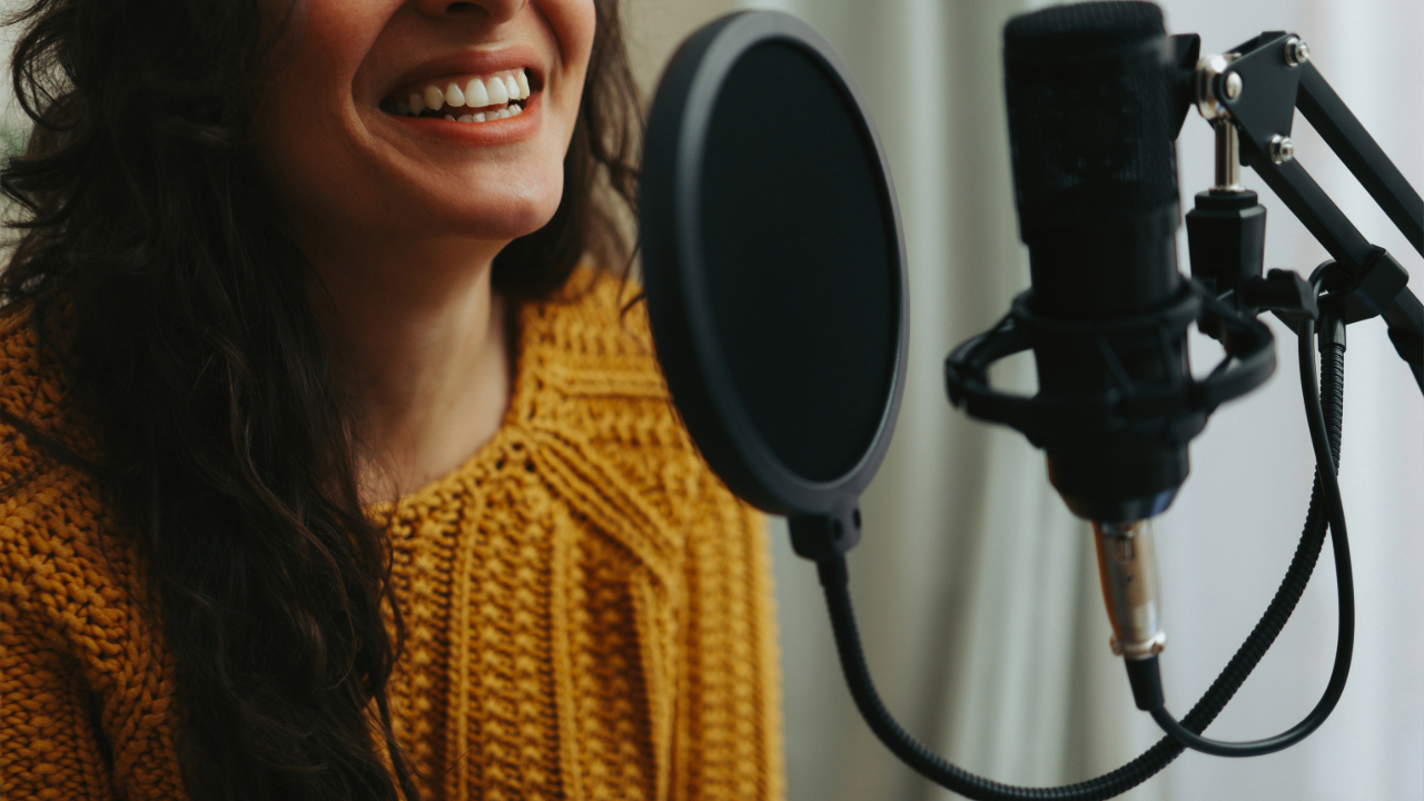 Voice actor recording audio in the booth